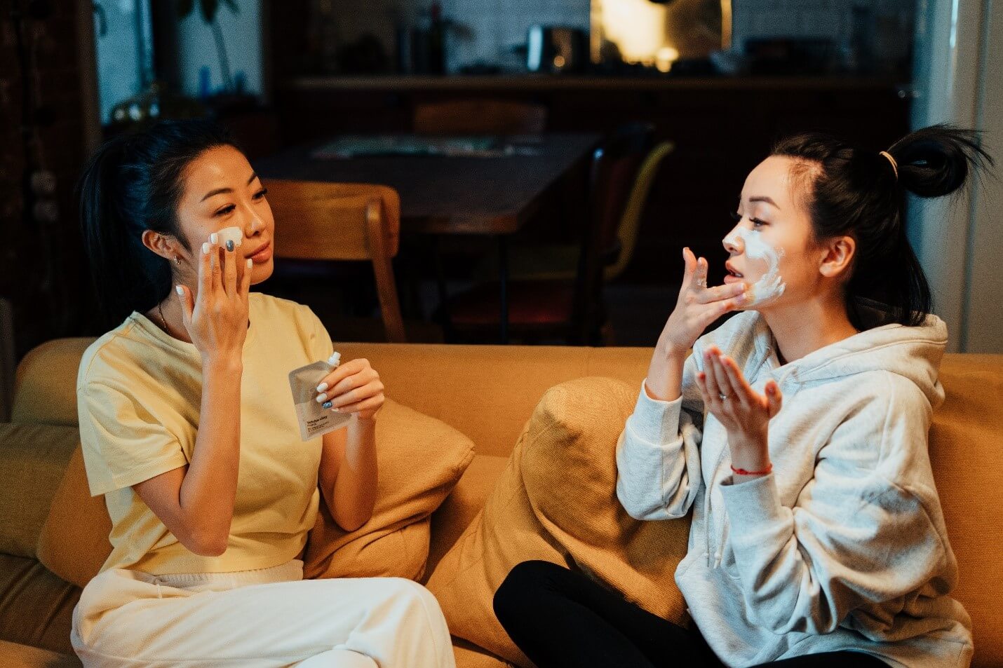 two women applying facials