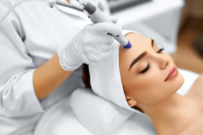 Beautician Treating Womens Face-min