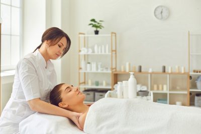 Women lying down about to receive facial treatment