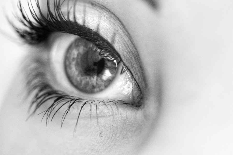 a close up image of a womans eye with eyelash extensions