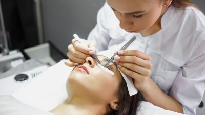 lash technician adding lashes