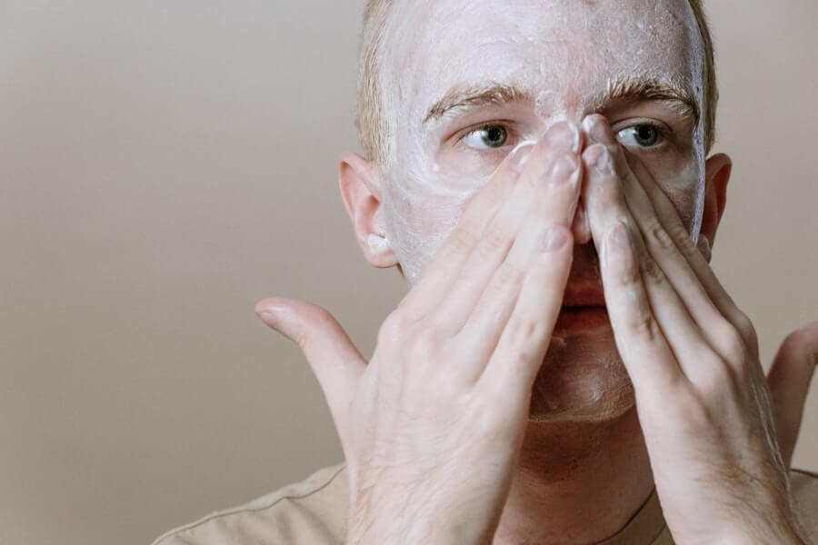 man checking can moisturizer cause pimples