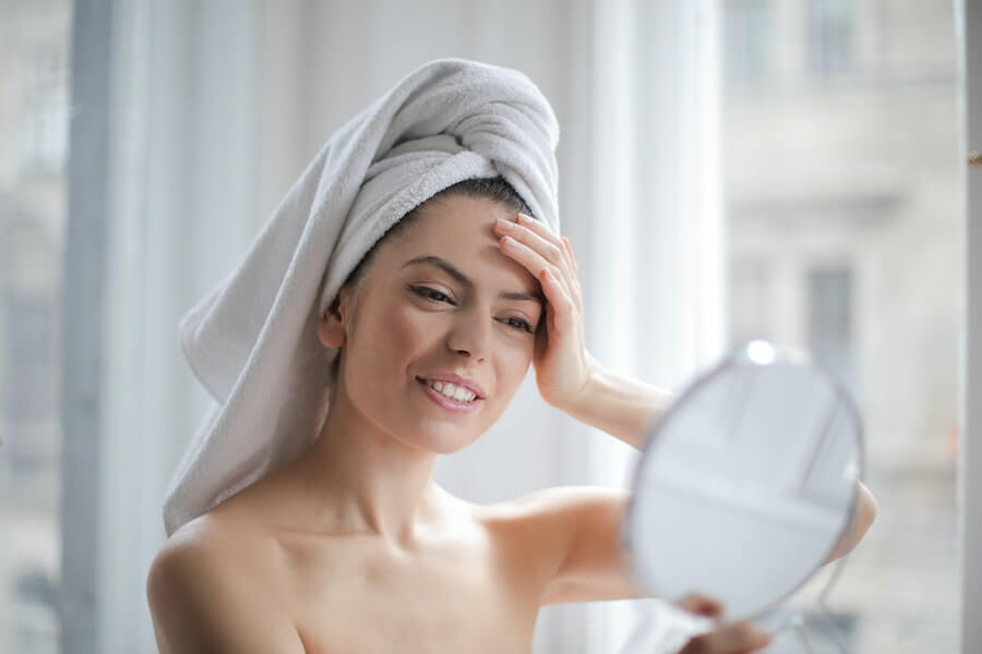 woman looking in a mirror