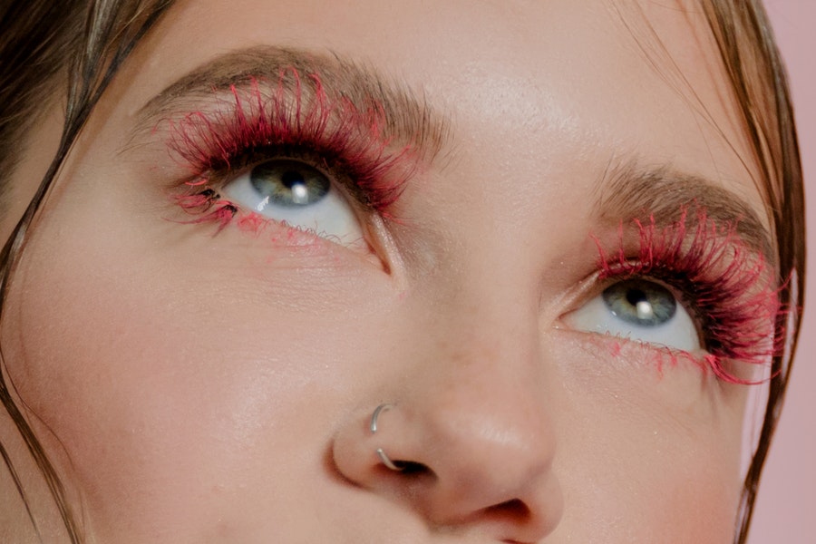 woman with red eyelash extensions