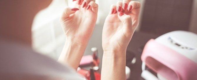 woman with a gel manicure at home