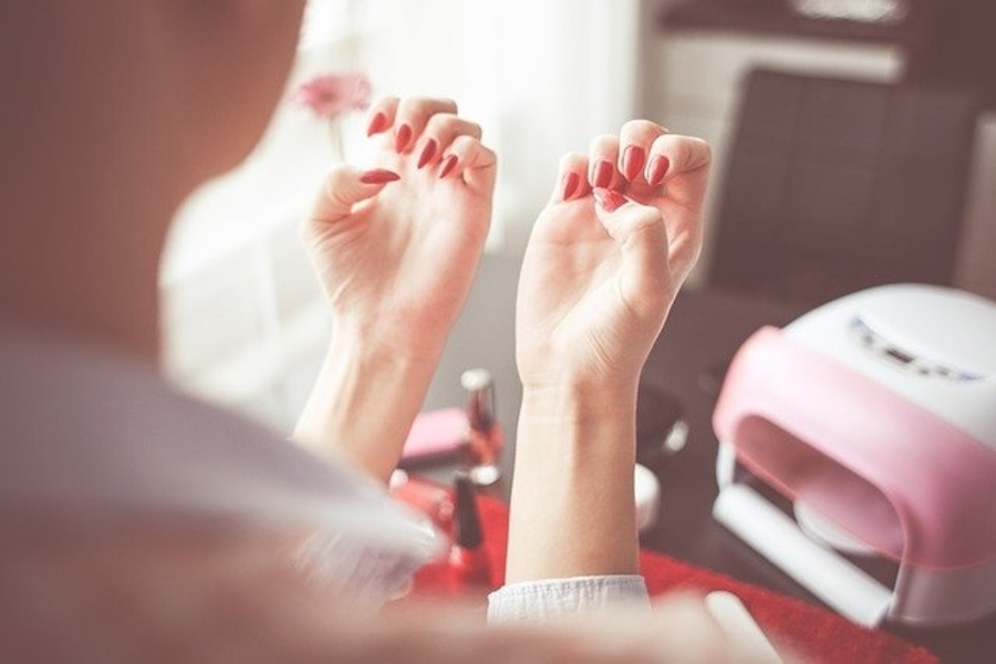 woman with a gel manicure at home