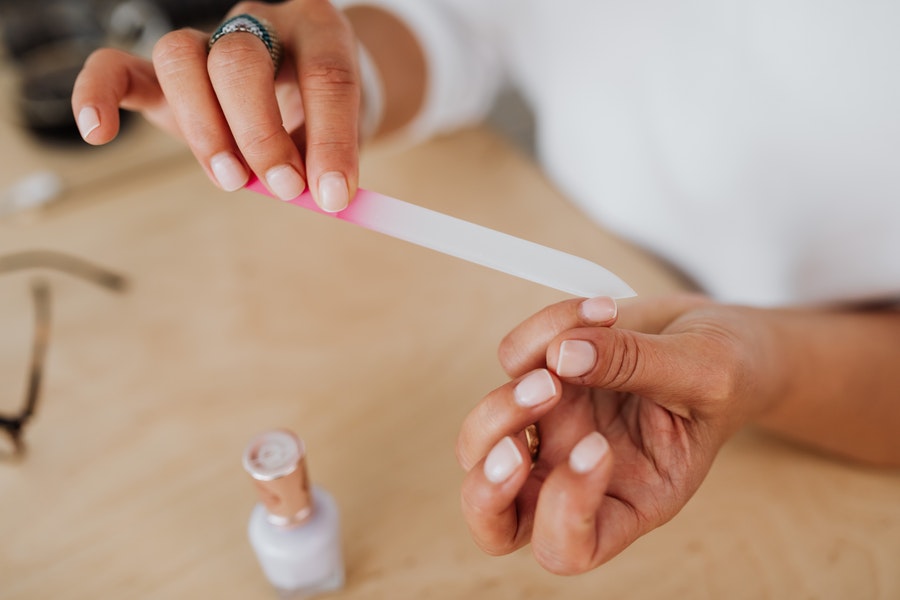 person filing nails