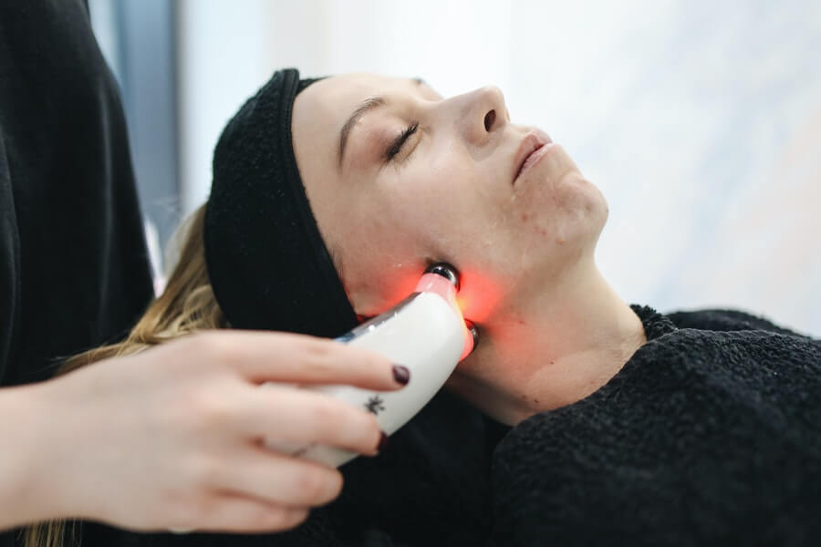 esthetician working with client