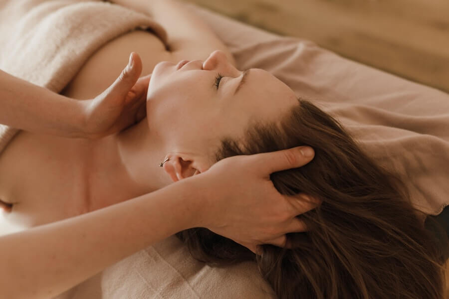 a skin therapist preparing a client's skin for treatment